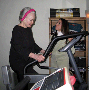 Vivian with patient on elliptical